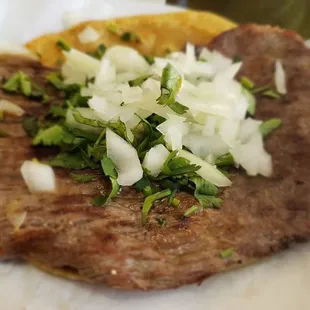 This is my up charge skirt steak taco, that's not skirt steak