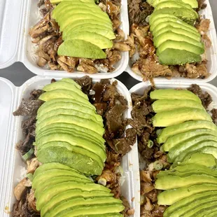 four trays of meat and avocado