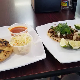 A papusa, carne asada taco and a carnitas taco