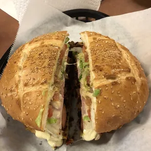 Torts Cubano - ham, chorizo, carne asada, hot dog, tomato, lettuce, avocado, beans and cheese