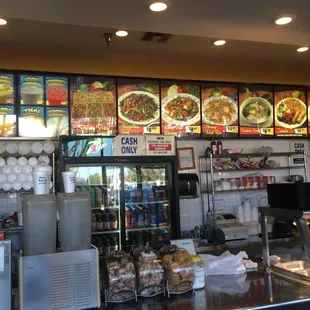 a restaurant counter with a variety of food items