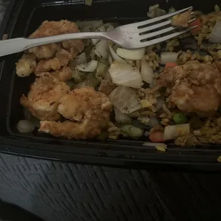 a fork in a container of food