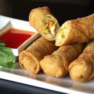 a plate of fried food with dipping sauce