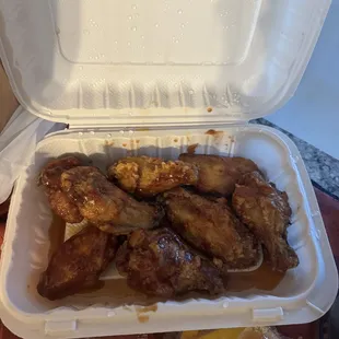chicken wings in a styrofoam container