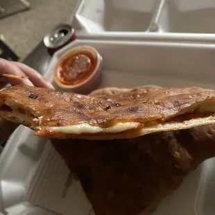 Most pathetic thing I&apos;ve seen. Pepperoni and &quot;Cheese&quot; Calzone. Was basically just dry flavorless dough.