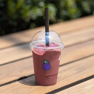 Superberry Signature Smoothie with a blend of antioxidant-rich acai, strawberries, blueberries, and raspberries.