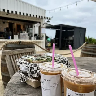 two cups of iced coffee on a table