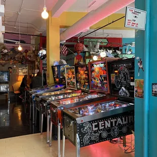 a row of pinball machines