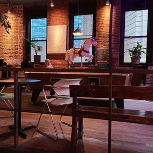 a woman sitting at a table in a restaurant