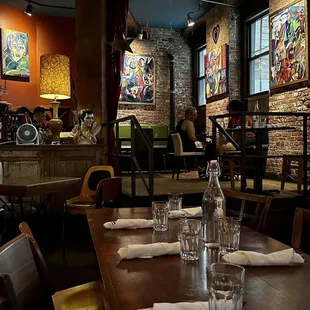 a dining room with tables and chairs