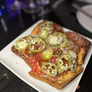 ULTIMATE PEPPERONI SQUARE $27 tomato, house mozzarella, &apos;nduja, sicilian oregano, ezzo pepperoni, pickled chile, honey