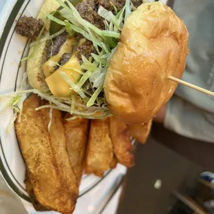 a hamburger and fries on a plate