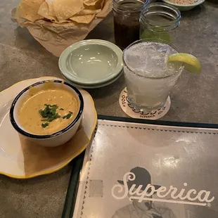 Delicious Chili Con Queso, salsas, and a margarita