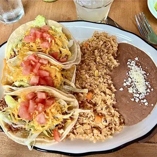 Chicken tinga tacos with rice and beans