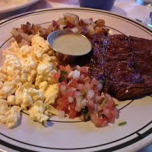 Skirt steak, scrambled eggs and potatoes