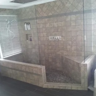 a walk - in shower and tub