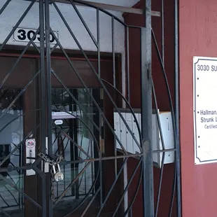 Padlocked front door of 3030 Superior (listed address of Superior Pho) during listed open hours