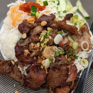 Cơm TấM ThịT NướNg Bì Grilled marinated pork and shredded pork on broken rice.