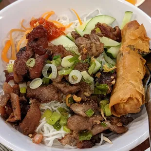 Bún ThịT NướNg Chả Giò Grilled marinated pork, veggies, fried spring roll on vermicelli noodles