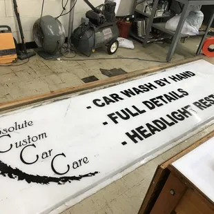 Absolute Custom Car Care brought us their outdoor sign panel to have it refurbished with new vinyl!