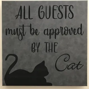 Seriously, the cat owns this house... and this leatherette plaque!