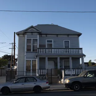 two cars parked in front of a house