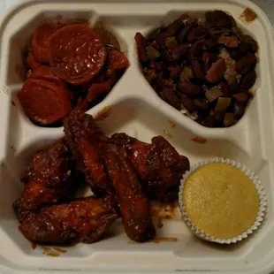 Top left then clockwise: candied yams, red beans &apos;n rice, cornbread muffin, BBQ chicken wings