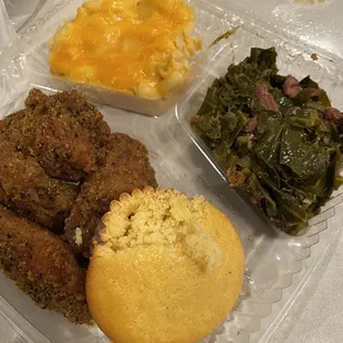 Lemon pepper chicken wings, greens (slight spicy kick) but deliciously tender and well seasoned, Mac n cheese, and cornbread