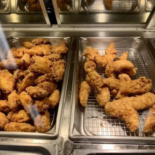Fried hot wings and moist chicken tenders