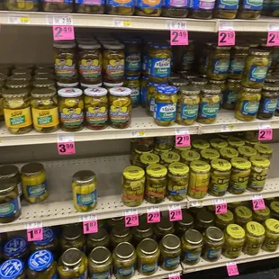 a variety of pickles on shelves