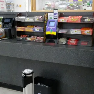 a checkout counter with a checkout machine
