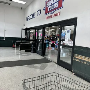 a shopping cart in front of the entrance
