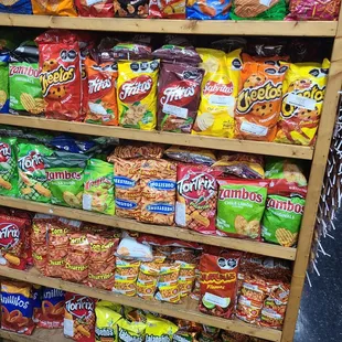 a shelf of chips and snacks