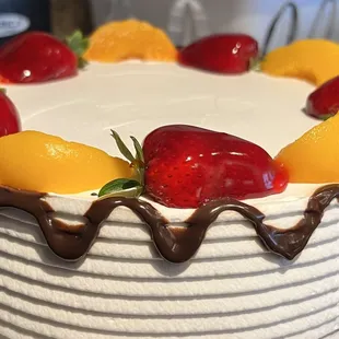  a cake decorated with fresh fruit