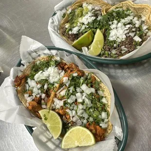 two tacoss on a table