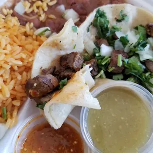 Three beef tacos meal with two sauces