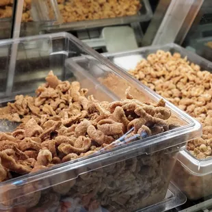 a variety of cereals in plastic containers