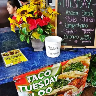 a taco tuesday sign and a taco tuesday sign