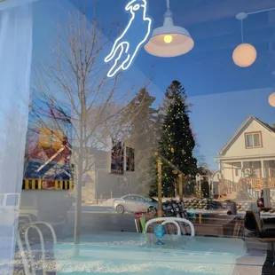a table and chairs in front of a window