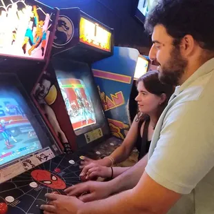 a man and a woman playing a video game