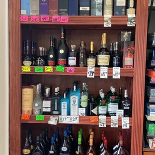 a shelf full of liquor