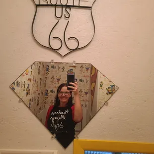 A must see bathroom with a limited edition wallpaper.