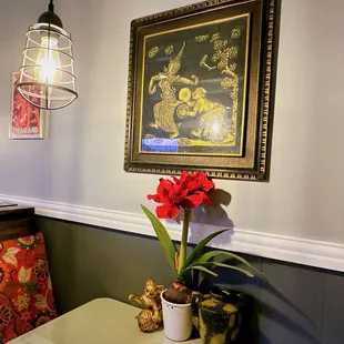 a red flower in a pot