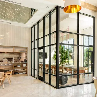 a dining room with large windows