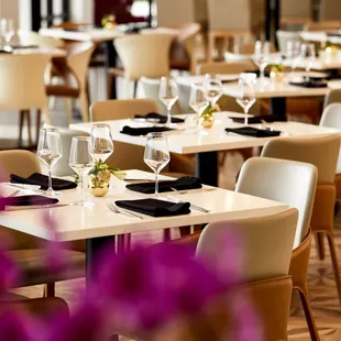 empty tables and chairs in a restaurant