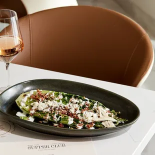 a plate of food and a glass of wine