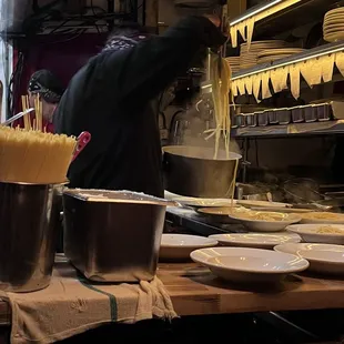 a man preparing food in a restaurant kitchen