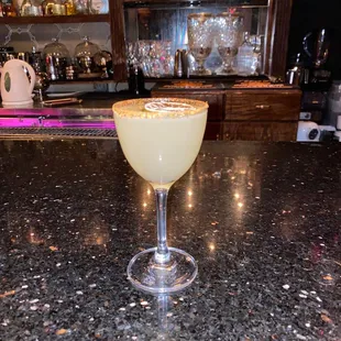 a margarita sitting on a bar counter