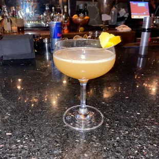 a cocktail sitting on a bar