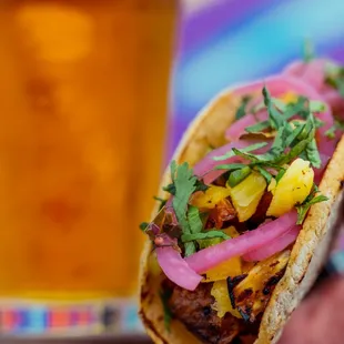 Tacos every Wednesday night!  Handmade tortilla, al pastor, pineapple salsa and pickled onions.